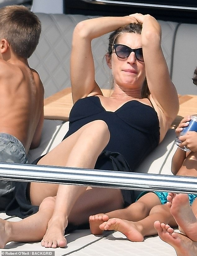 Gisele Bundchen, 44, shows off her post-baby body on lavish yacht as ex Tom Brady is 'casually dating'