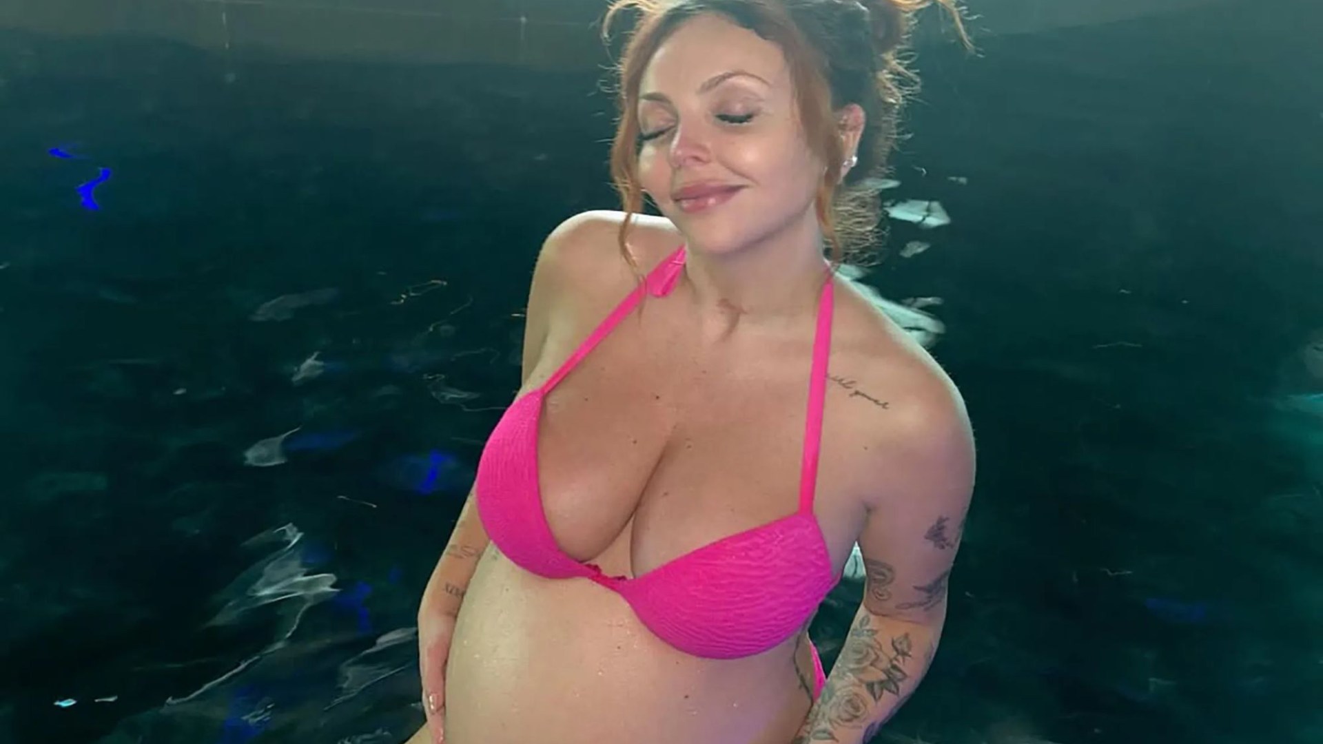 Pregnant Jesy Nelson flaunts blossoming baby bump as she strips to pink bikini ahead of welcoming twins