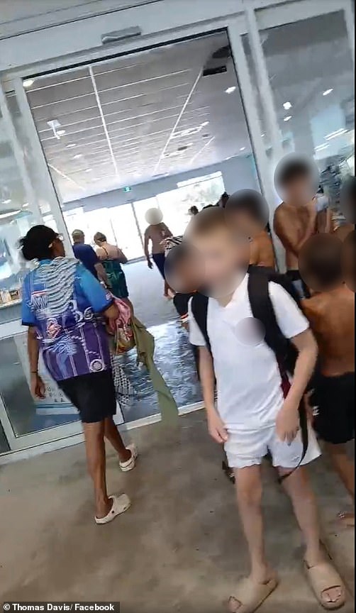 Wild moment parent erupts at local pool for kicking out 'every Aboriginal visitor' as tense footage emerges of cops at the scene - as management is forced to clear the air